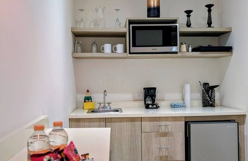 Historic Center Apartment | Casa Donceles Studio with King Bed, Kitchenette, Complimentary baggage storage.