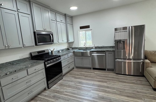 Ferndale House | Charming 2-bedroom barndominium with indoor basketball/pickleball court and pond