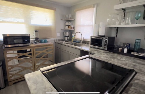 Ash Cottage | Charming 2-bedroom riverside cottage near beaches with huge bar and deck to fish