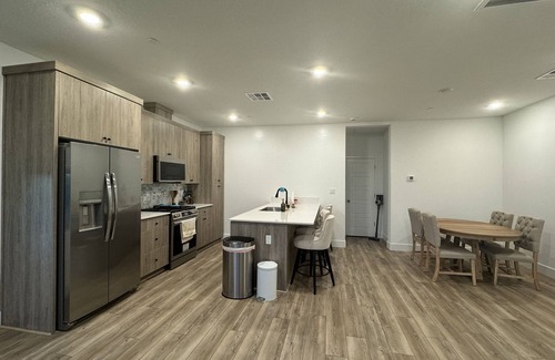 Clovis House | Charming 2-bedroom townhome with garage, pool access, & all utilities included.