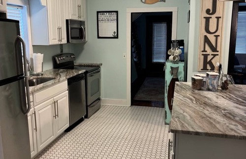 Ludington House | Charming 4-bedroom house sleeps 15 in the wonderful beach town of Ludington!