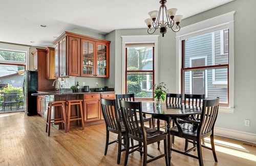 Uptown House | "Charming 4BR Home Steps to Lake of the Isles with Fenced Yard & Deck"