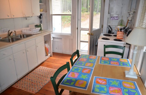 Milton Cottage | Charming lakefront cottage with sandy beach on a large private wooded lot