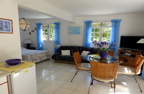 Les Abymes Apartment | Charming studio in a tropical garden. with swimming pool, free wifi and parking.