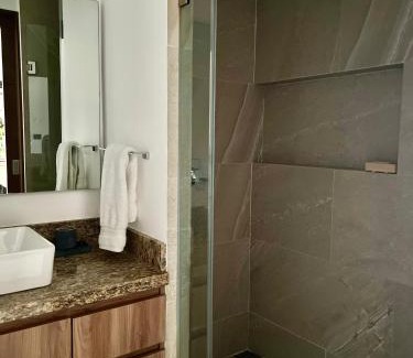North Hotel Zone Apartment | Chic 1BR 1BA Zoho Skies condo with rooftop pool stunning views