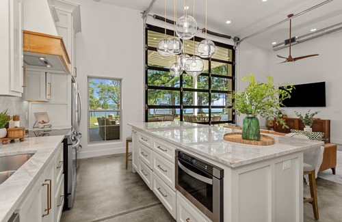 Broaddus House | Chic Lakefront Home | Majestic Views | Cowboy Pool | Outdoor Cinema | Water Toys