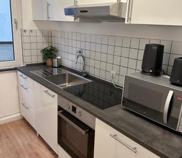 Sudostviertel Apartment | City Apartment with 2 individual beds and sleeping sofa and kitchen