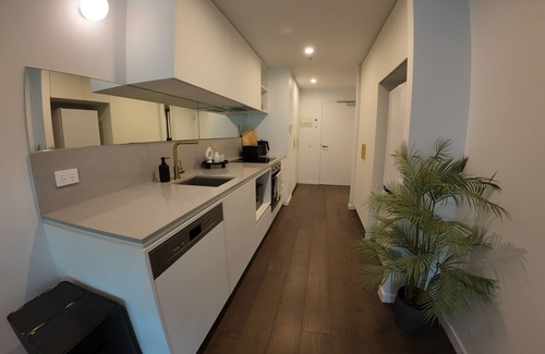 Reid Apartment | City Retreat with Rooftop Pool, Private Parking & City Views