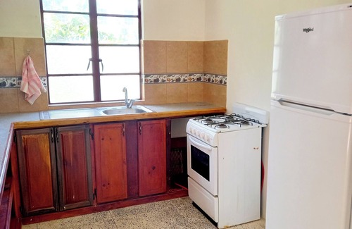 Calibishie House | Comfortable, local home with A/C and private verandah