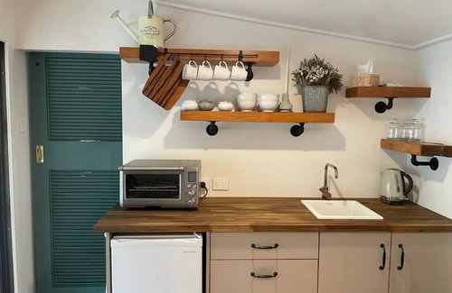 Wanganui District House | Cosy guest sleep out with sauna on dairy farm