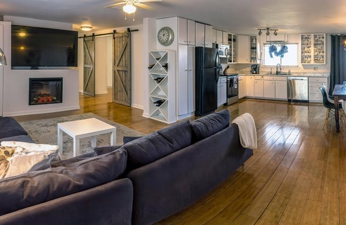 Talent Apartment | Cottage offers a sectional sofa, chef's kitchen and open floor plan.