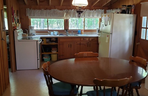 Waupaca Cottage | Cottage on Long Lake on the Chain O' Lakes with sandy shore and pontoon rental.