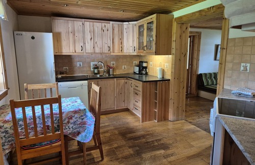 Rimbo House | Cottage on the lake with grazing horses as neighbors