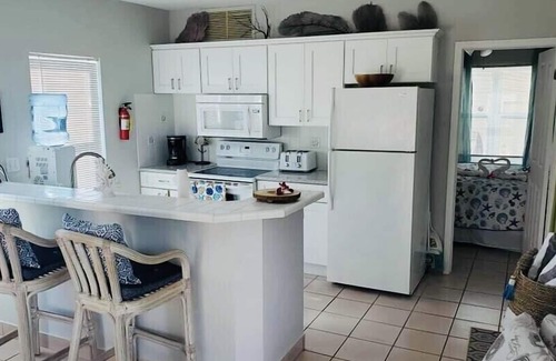 Wheeland Settlement Condo | Couple’s Retreat! Condo with ocean views, pool, and hottub!