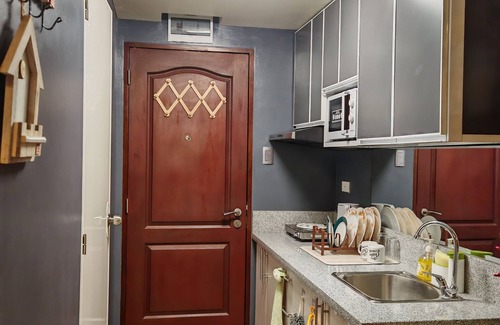 Silang Condo | Cozy 1-bedroom condo with AC, WiFi in serene Silang Kitchen mini karaoke.