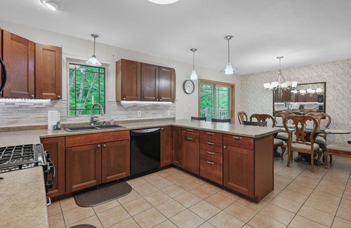 Mosinee Apartment | Cozy 2-Bedroom Retreat with Wooded Views, Fire Pit & Stylish Kitchen!