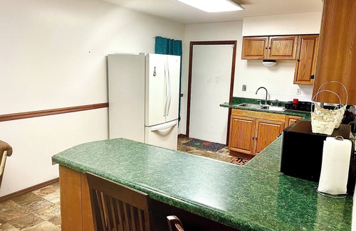 Kistler House | Cozy 4-bedroom house in Man w WiFi, arcade game, and extra parking. Near trails.