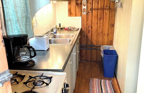 Itasca County Resort | Cozy cabin on lakeside with free dock space and amazing swimming beach
