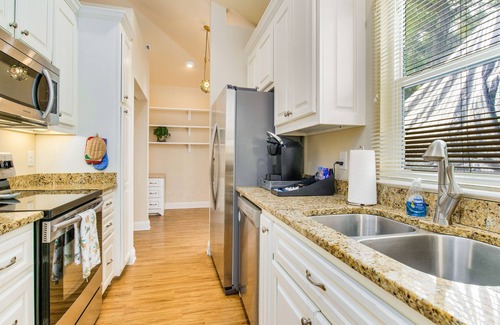 East Hill House | Cozy Carriage House with Pool, Bikes, and Charming Neighborhood