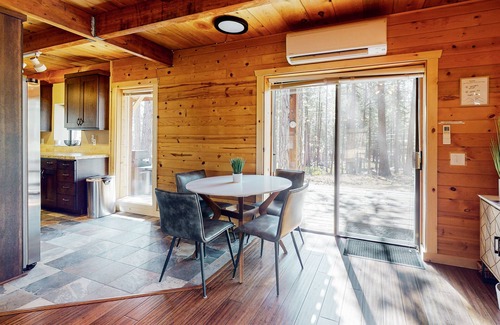 River Forest Acres Cabin | Cozy & colorful retreat with a deck, grill, wood stove, board games, W/D, & AC