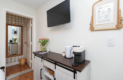 Courtenay House | Cozy hotel like bedroom suite with fridge, microwave, coffee and full piece bath