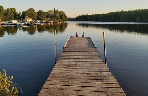 Magnetawan Cottage | cozy lakefront cottage with firepit and boat dock