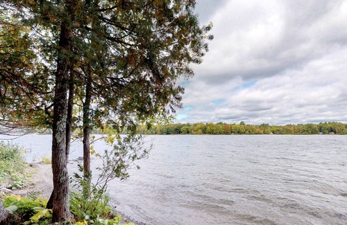 Dexter House | Cozy lakefront home w/ a firepit, outdoor shower, & private beach!