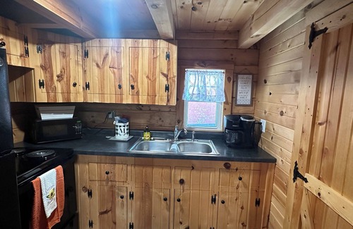 Moravia Cabin | Cozy log cabin located in downtown Moravia, Iowa.