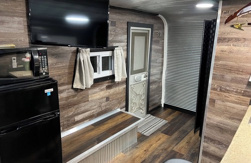 Chapman RV Rental | Cozy modified camper cabin