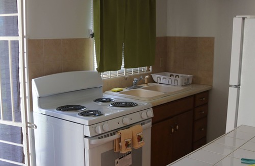 Frigate Bay House | Cozy Romantic Bungalow — 3 min walk to the beach, in front of the golf course!