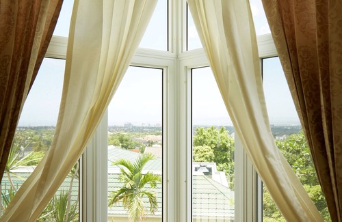 Jack's Hill House | Crowne Gardens. Safe, quiet, luxurious Kingston home with a scenic view.