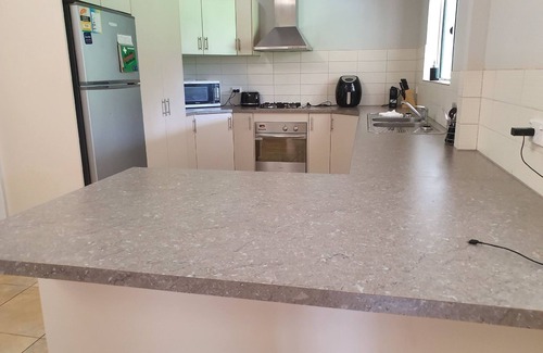 Dundee Beach House | Curlew Lodge -1 road back from beach. Limited WiFi is now available