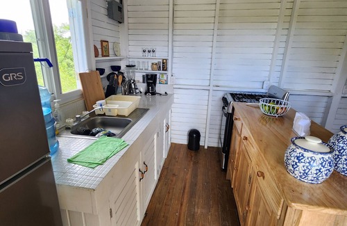 Rio Dulce Cabin | Cute & Cozy Caribbean Cabin on a farm.