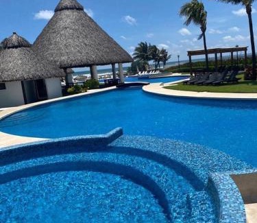 Boulevard Barra Vieja Apartment | Departamento Boutique con 7 Albercas, Club de Playa y Casa Club