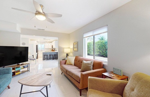 Isles of Capri Condo | Dog-friendly colorful condo with shaded patio, washer/dryer, & central AC