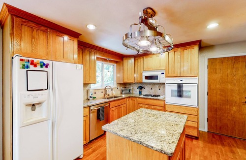 Maple Heights-Lake Desire House | Dog-friendly home with large yard, inviting deck & spacious layout