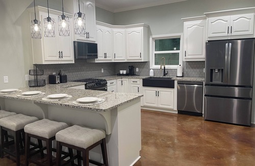 Titus House | Dogwood Cottage at Lake Jordan with boat dock/hot tub lakeside/RV parking spot