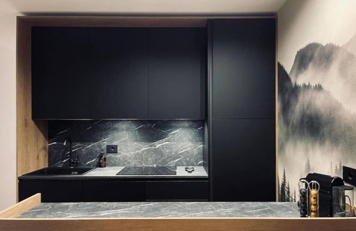 Tesero Apartment | Dolomiti Haus 300 ft from Pampeago ski lifts.