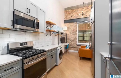 Central City Condo | Downtown Luxe Industrial Loft in Mercantile on Morris! Free parking! Dogs ok.
