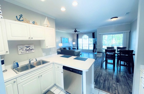 Central Myrtle Beach Condo | Endless Summer Coastal Condo at Magnolia Place - Pool & Golf Course Views!
