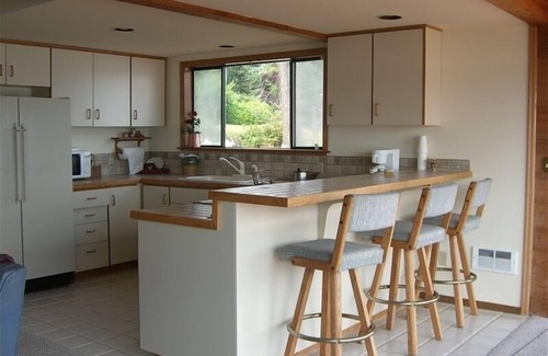 Fox Island Cottage | enjoy island living on a sandy Puget Sound beach with a view of Mt. Rainier