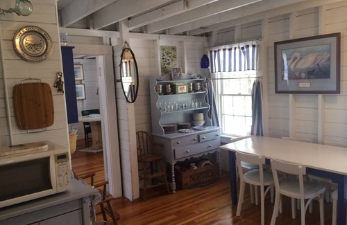 Silver Beach Cottage | Escape to Costal Comfort. Step Back In Time at this Waterfront Retreat!