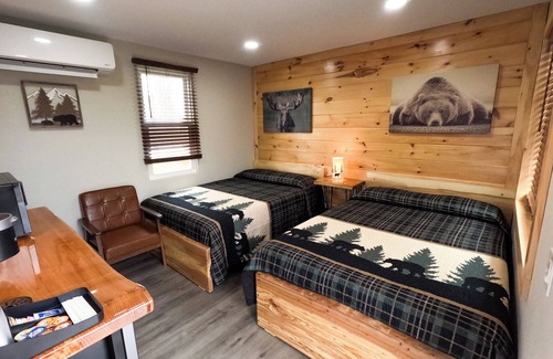 North Greece Hotel | Escape to the tranquility of our cozy cabin inn, where rustic charm meets modern comfort. Experience a home away from home ambiance.