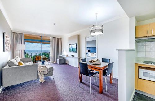 Darwin City Centre Apartment | Esplanade Poolside Living with Lush Balcony Vistas