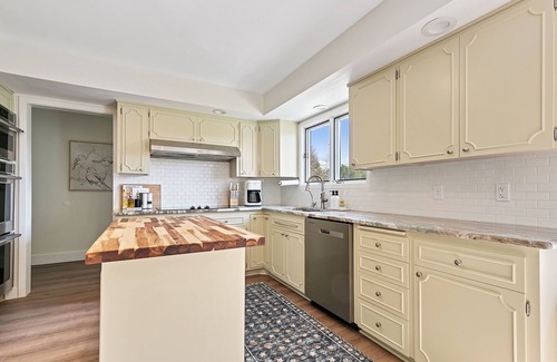 Riverside House | Evergreen Lodge - Enjoy relaxing in the hot tub or smores by the fire!