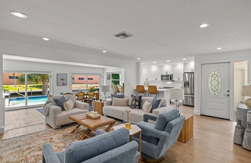Shell Harbor House | Exceptional canal front home, beautiful design, steps to beach!