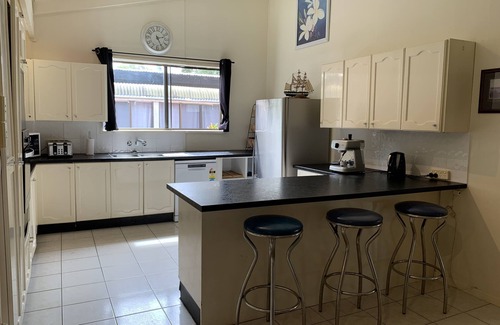 Brisbane Waterfront House | Family and Pet Friendly Peaceful Island Waterfront Home With Bikes and Kayaks