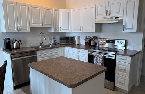 Redcliff Apartment | Family-friendly remodelled historical church to private suits!n10 min to Costco!
