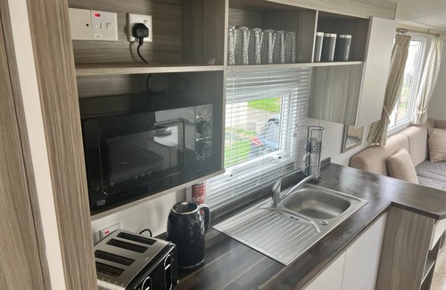 Towyn House | Family fun retreat at our caravan swift stays with everything you need around.