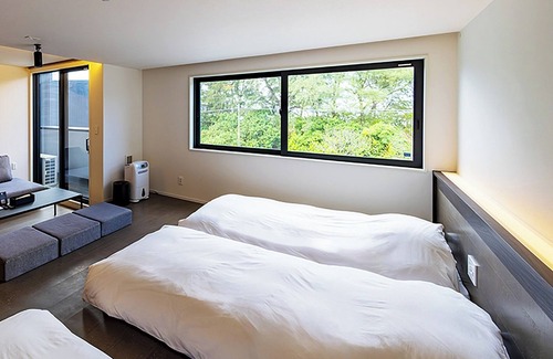 Akaogi Hotel | Family room modern kitchen with stove/Oshimagun Kagoshima